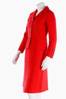 Lot 140 - A Chanel couture bright red tweed suit, 1974,...