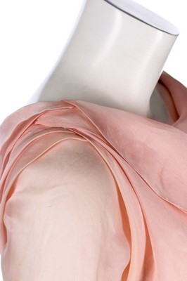 Lot 177 - A Christian Lacroix couture pale-pink organza...
