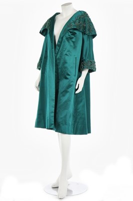 Lot 40 - A peacock-green satin evening coat, probably...