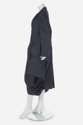 Lot 163 - A John Galliano navy gabardine 'Pannier' coat,...