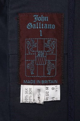 Lot 163 - A John Galliano navy gabardine 'Pannier' coat,...