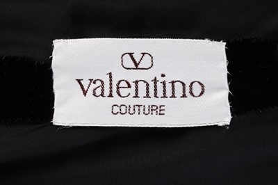Lot 180 - A Valentino couture black velvet and pink...