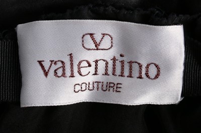Lot 181 - A Valentino couture black velvet and sequinned...