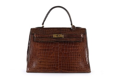 Lot 7 - An Hermès brown crocodile Kelly bag, 1962,...