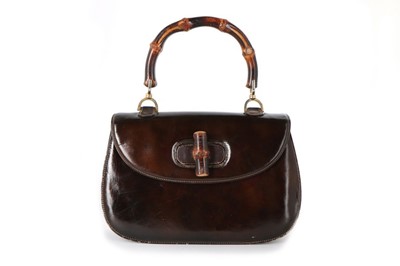 Lot 8 - A Gucci handbag with bamboo handle, 1960s,...