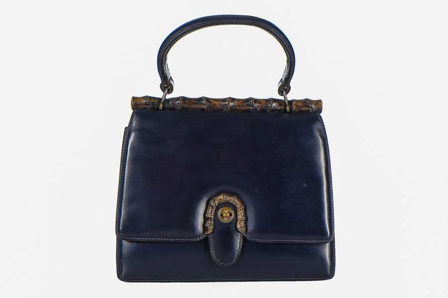 Lot 4 - A Gucci navy leather handbag, late 1950s-early...