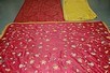 Lot 87 - A unusual appliqud crimson satin coverlet,...