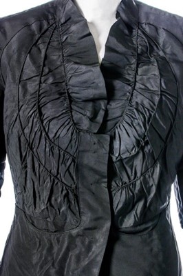 Lot 68 - A Schiaparelli couture black faille evening...