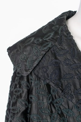 Lot 85 - A Jacques Fath embroidered black satin tent coat, 1954