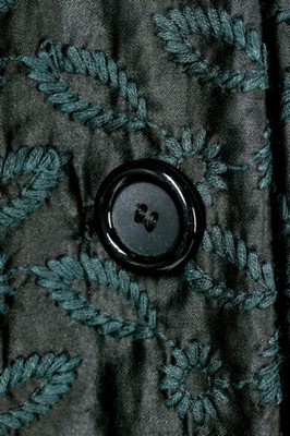 Lot 85 - A Jacques Fath embroidered black satin tent coat, 1954