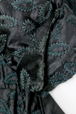 Lot 85 - A Jacques Fath embroidered black satin tent coat, 1954