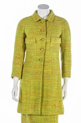 Lot 95 - A Chanel couture chartreuse tweed suit, 1968,...