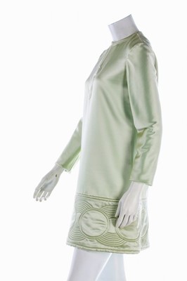 Lot 108 - A Pierre Cardin quilted aqua satin mini-dress,...