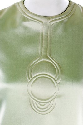 Lot 108 - A Pierre Cardin quilted aqua satin mini-dress,...