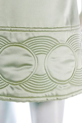Lot 108 - A Pierre Cardin quilted aqua satin mini-dress,...
