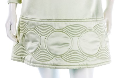 Lot 108 - A Pierre Cardin quilted aqua satin mini-dress,...