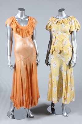 Lot 192 - A floral printed yellow voile garden party...