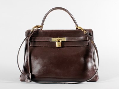 Lot 22 - An Hermès dark brown leather Kelly bag, late...