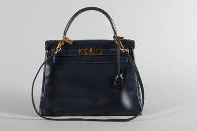Lot 17 - An Hermès navy box leather Kelly bag, circa...