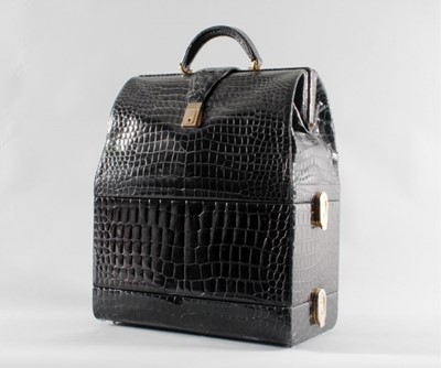 Lot 18 - A large black crocodile travelling...