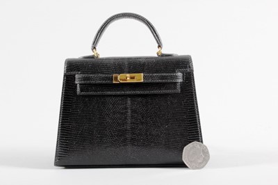 Lot 16 - An Hermès black lizard miniature Kelly bag,...