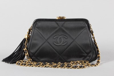 Lot 9 - A Chanel quilted satin evening bag, 1980s,...