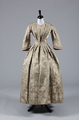 Lot 65 - A mushroom silk damask dress, mid 19th century...