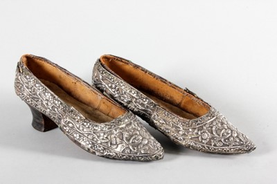 Lot 62 - A pair of repoussé lady's shoes, probably...