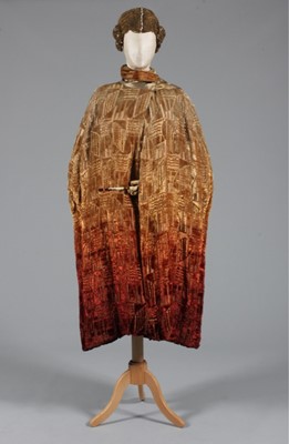 Lot 94 - A cut velvet opera cape and a gold cord wig,...