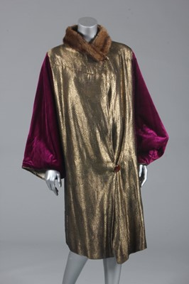 Lot 95 - A magenta velvet and gold lamé evening coat,...
