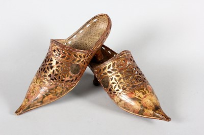 Lot 64 - A fine and rare pair of gilded and painted...