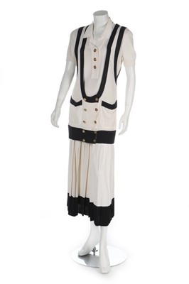 Lot 46 - A Chanel ivory and navy three-piece knitted...