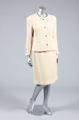 Lot 73 - A Chanel cream wool suit, 1970s, boutique...