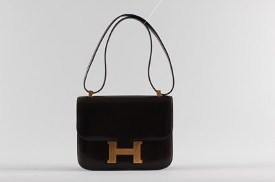Lot 17 - An Hermès 'Constance' chocolate brown leather...