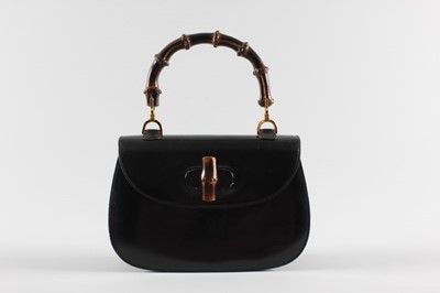 Lot 3 - A Gucci black leather 'bamboo' handbag, 1960s,...