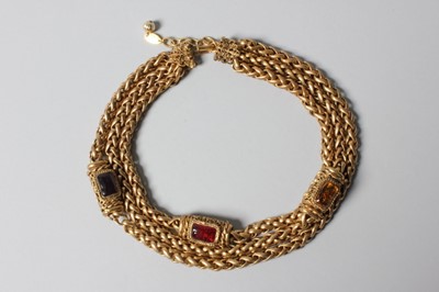 Lot 20 - A Chanel triple strand necklace, dated 1983,...