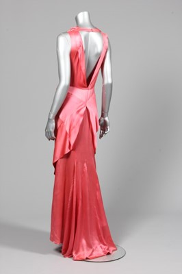 Lot 46 - A deep rose-pink satin bias cut couture...