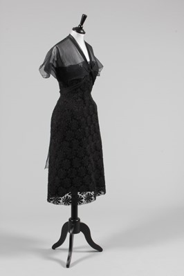 Lot 63 - A Balenciaga couture black lace cocktail dress,...