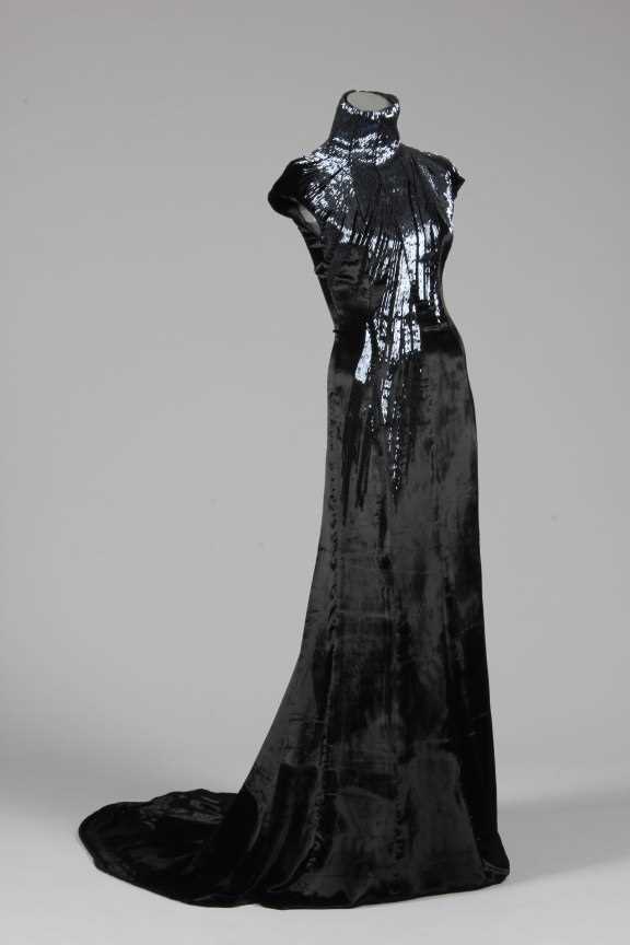 Lot 158 - An Alexander McQueen black velvet and bugle...