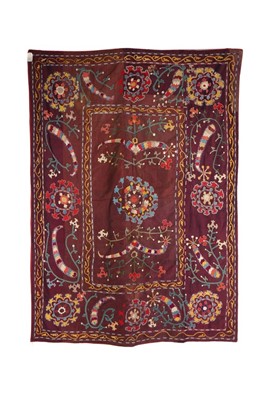 Lot 468 - An embroidered shot-purple silk suzani, Uzbek,...