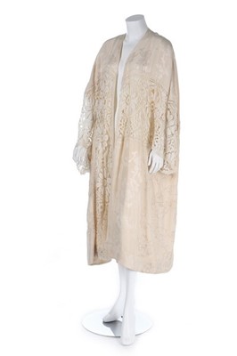 Lot 100 - An ivory silk damask kimono-style robe, 1920s,...
