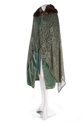 Lot 106 - A green velvet evening ensemble, early 1920s,...