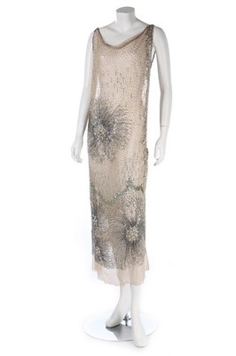 Lot 107 - A good embellished nude tulle evening dress,...