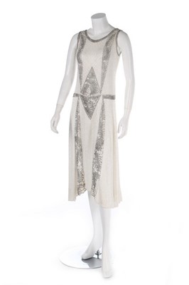Lot 109 - A beaded white muslin flapper dress, circa...