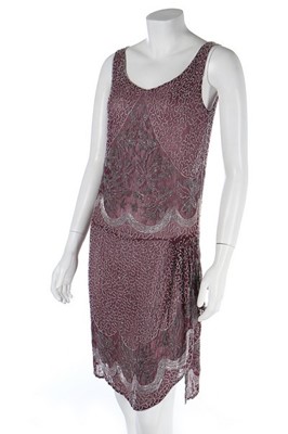 Lot 111 - A beaded mauve muslin flapper dress, circa...
