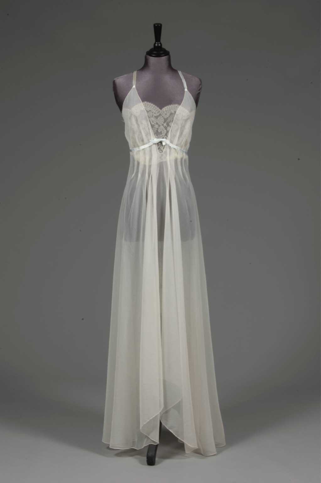 Lot 91 - An ivory chiffon nightdress, 1950s, with lace...