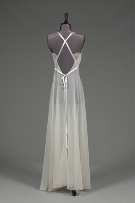Lot 91 - An ivory chiffon nightdress, 1950s, with lace...