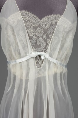 Lot 91 - An ivory chiffon nightdress, 1950s, with lace...
