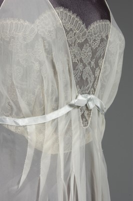 Lot 91 - An ivory chiffon nightdress, 1950s, with lace...