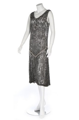 Lot 124 - A beaded lace flapper dress, late 1920s, with...